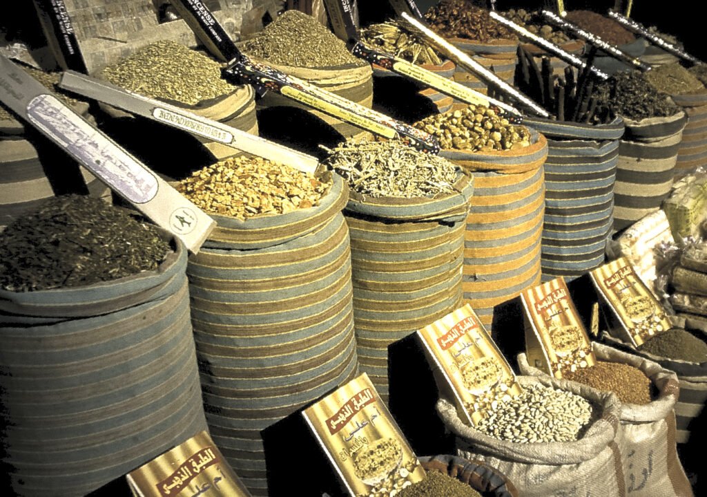 Woven sacks of spices, dried herbs and incense on display in a Cairo bazaar stall