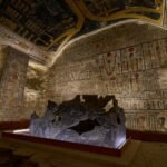 The burial chamber of a tomb in the Valley of the Kings, with the granite sarcophagus and walls covered in painted texts